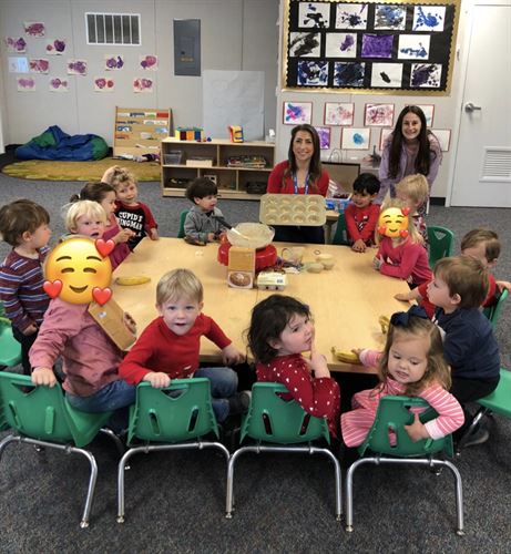 kindergarten class and instructors sitting together